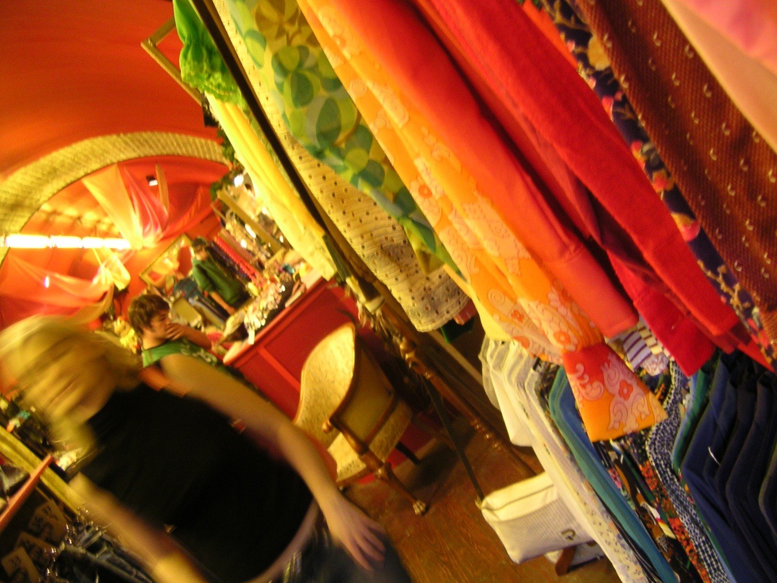 a store display containing fabrics, clothes and more