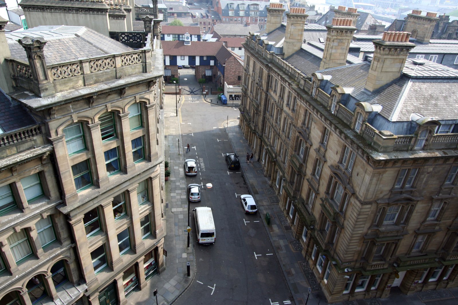 an overhead view of two streets with many buildings