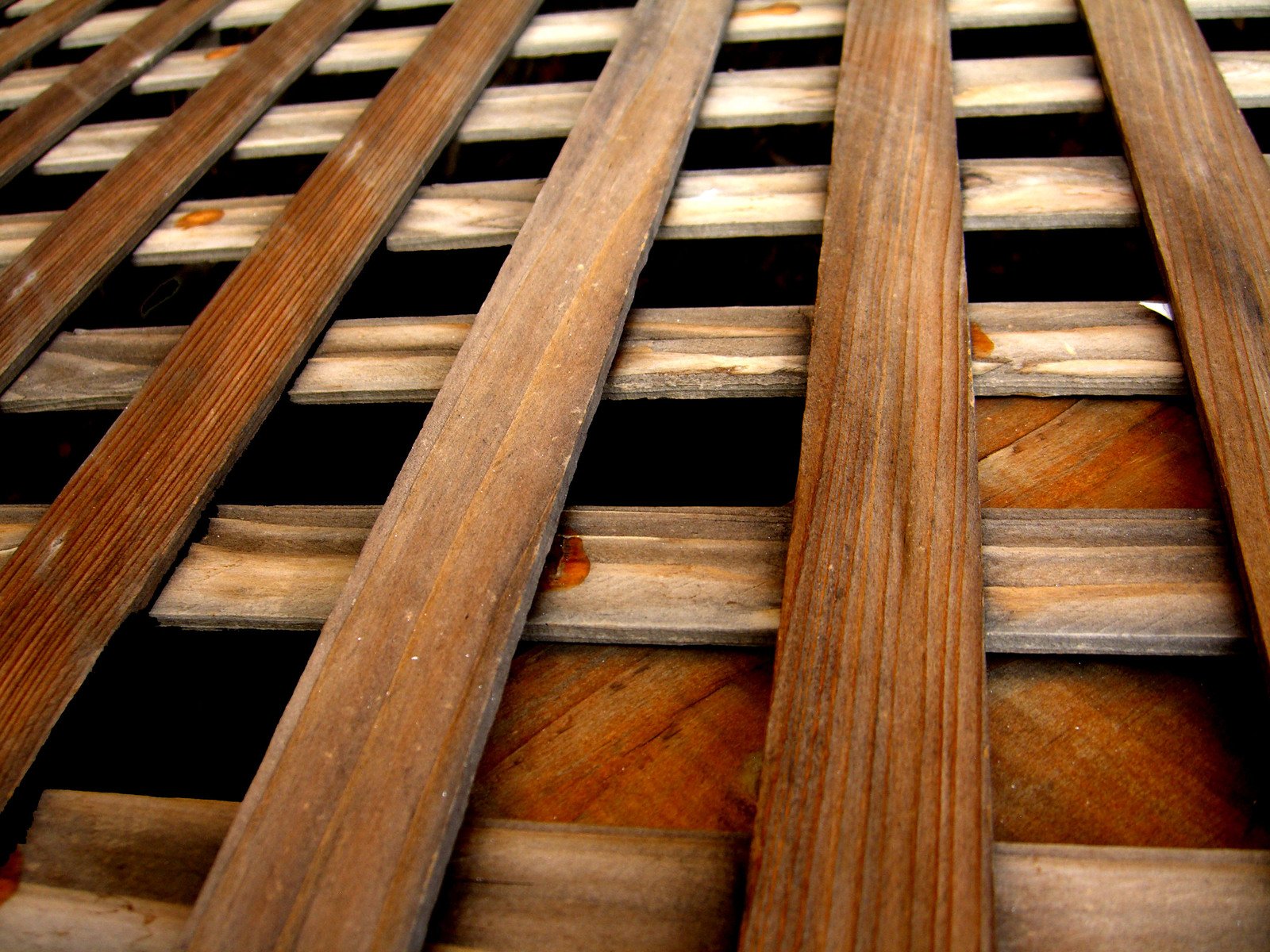 an array of wood and slats arranged in an angled pattern