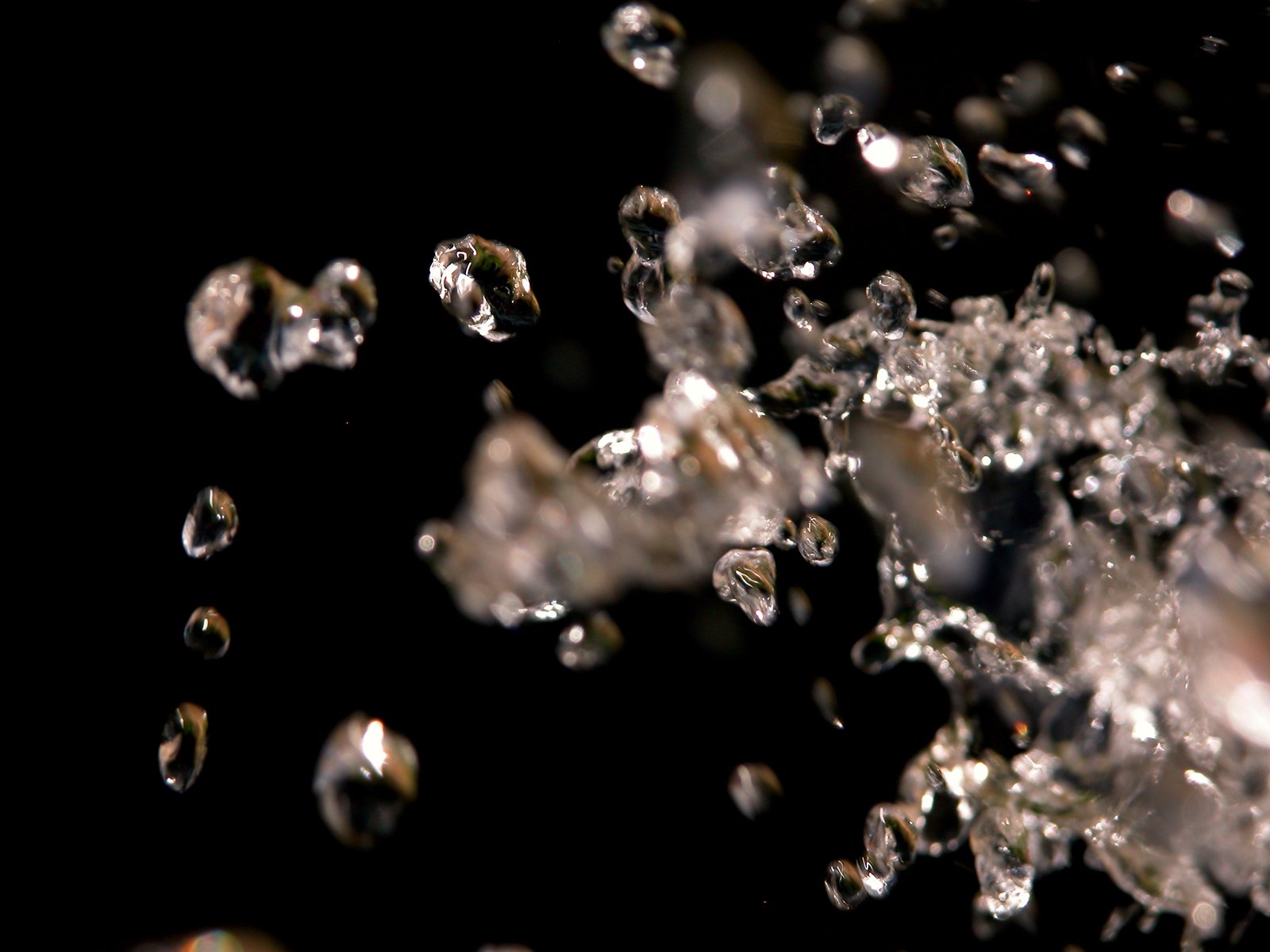 several small diamonds falling off of the side of a building