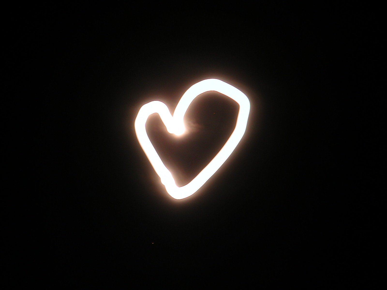 a light painting depicting the heart on a black background