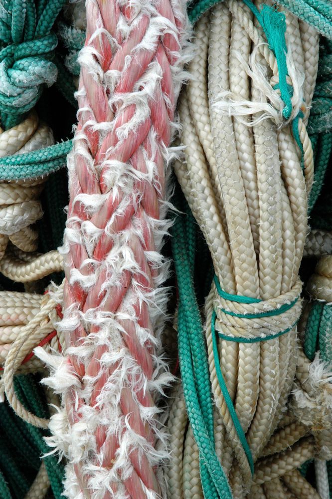 several ropes stacked up together in a pile
