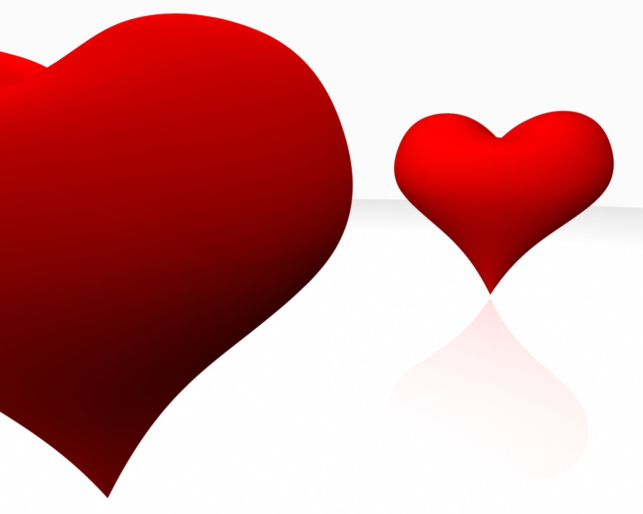 red hearts sitting side by side in front of a white background