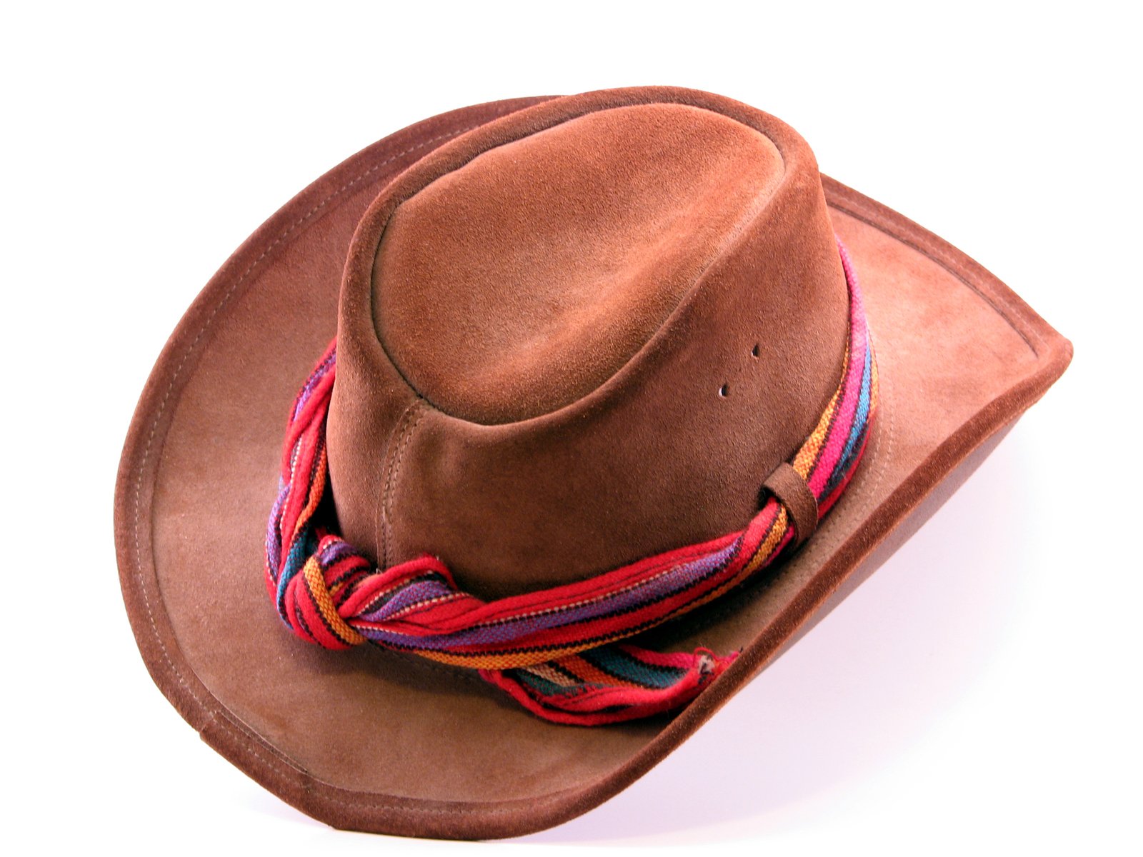 a brown cowboy hat with multi colored rope on top