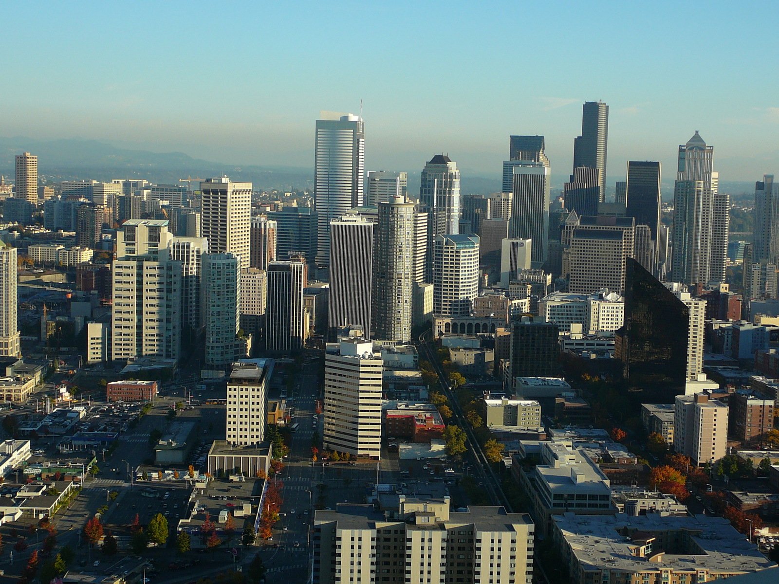 an aerial view of many large buildings in the city