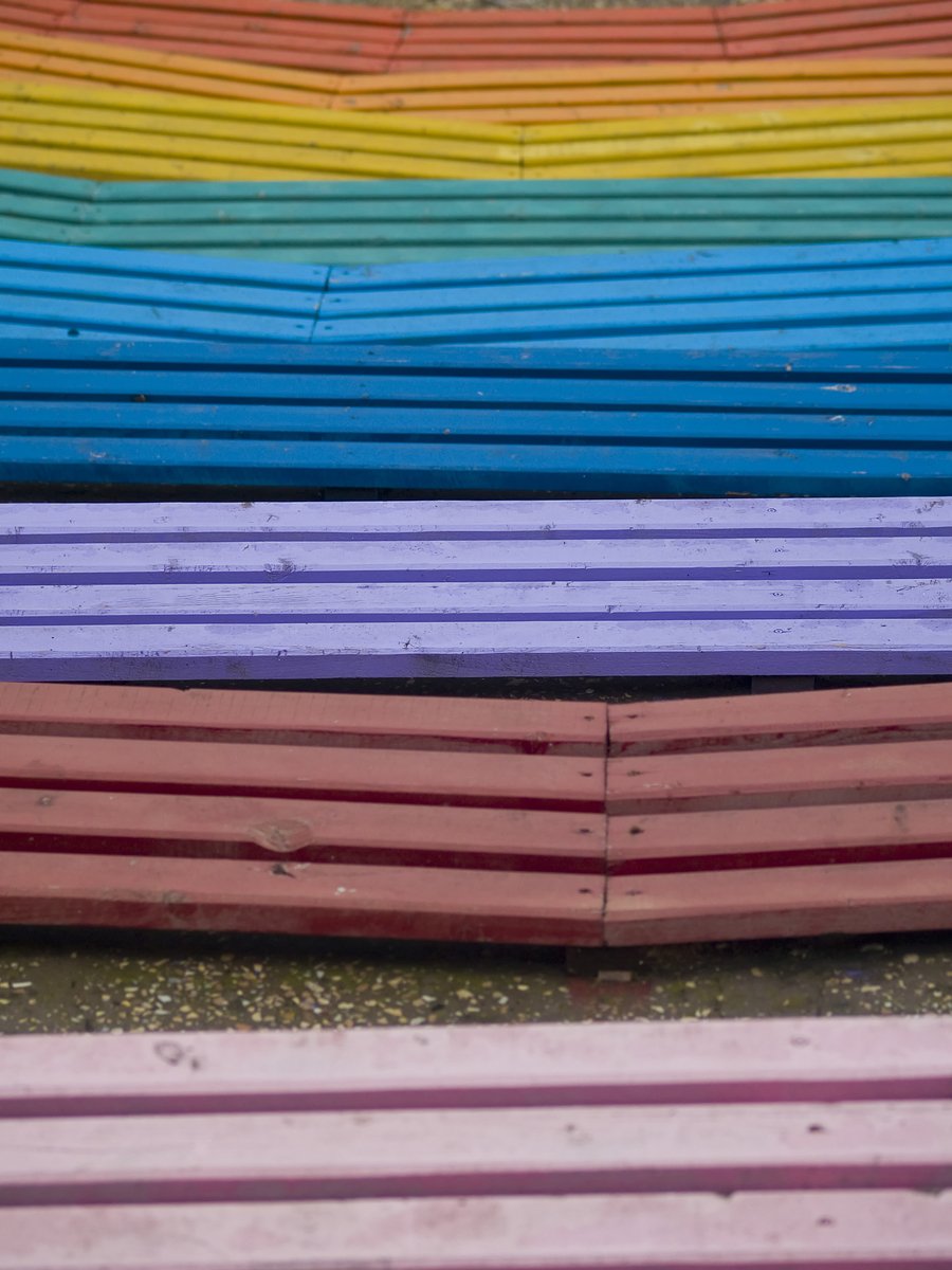 rows of different colored wooden boards stacked together