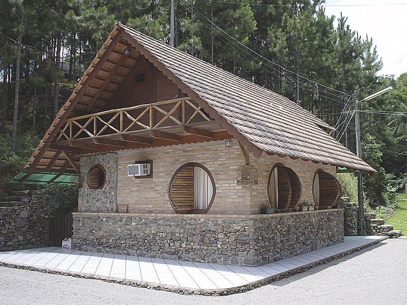 a building with a roof made of rocks