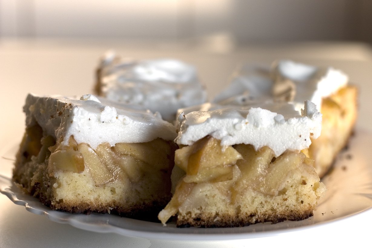 a white plate with a piece of pie on top