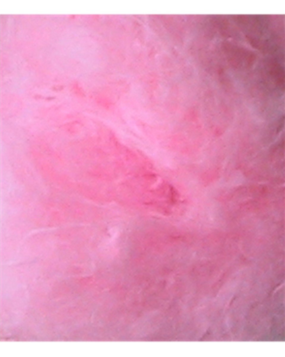 a fluffy pink piece of wool with white patches