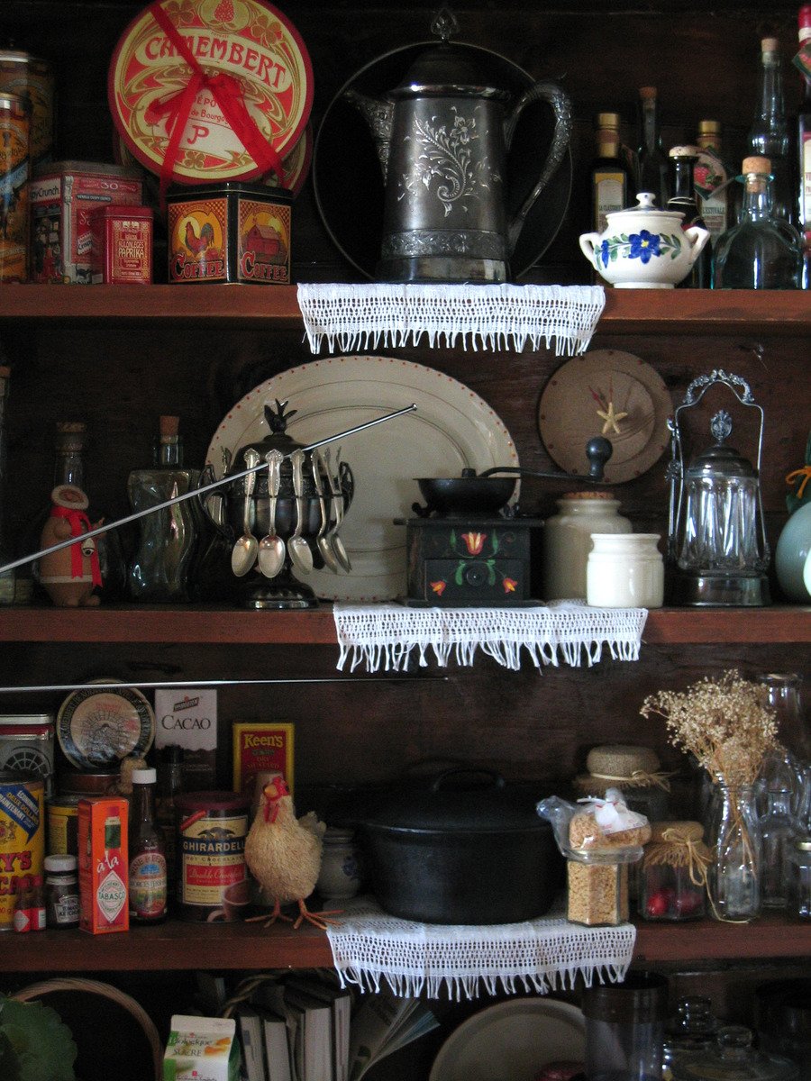 a shelf full of various items from an antique store