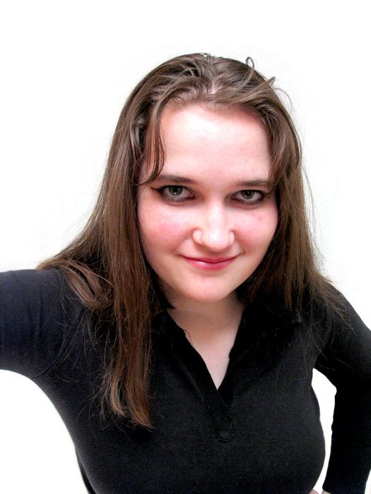 a woman wearing a black shirt holding a cell phone