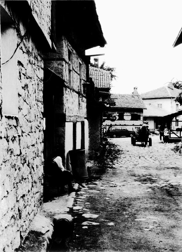 an old black and white po of a town street