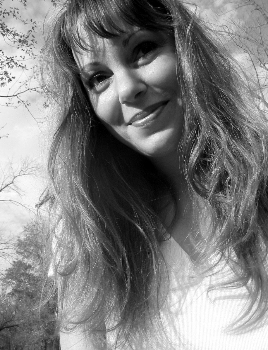 black and white image of a woman smiling for the camera