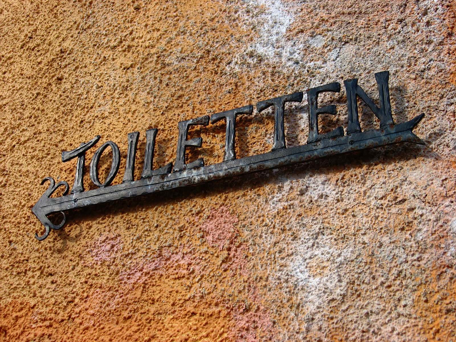 rusted metal street sign with the word stolen on it