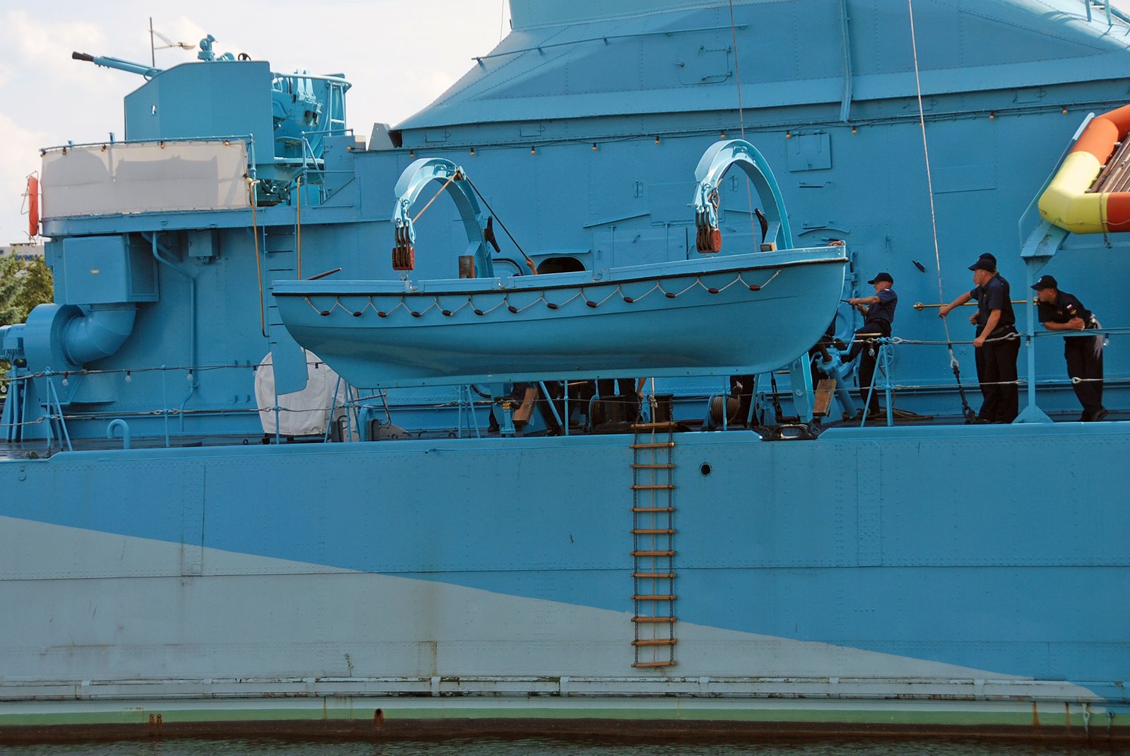 a large ship with people standing on it