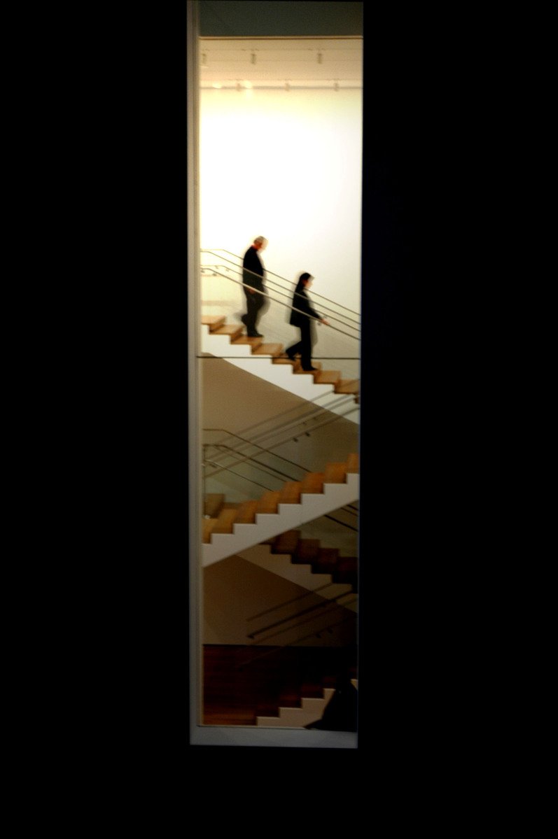 two people are going up some stairs next to each other