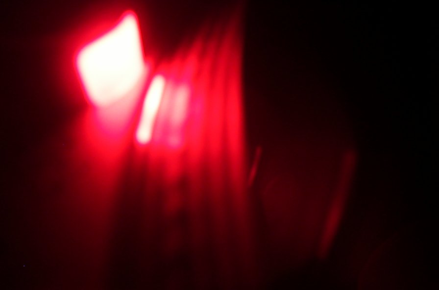 a close - up view of the camera flash of red light on the floor
