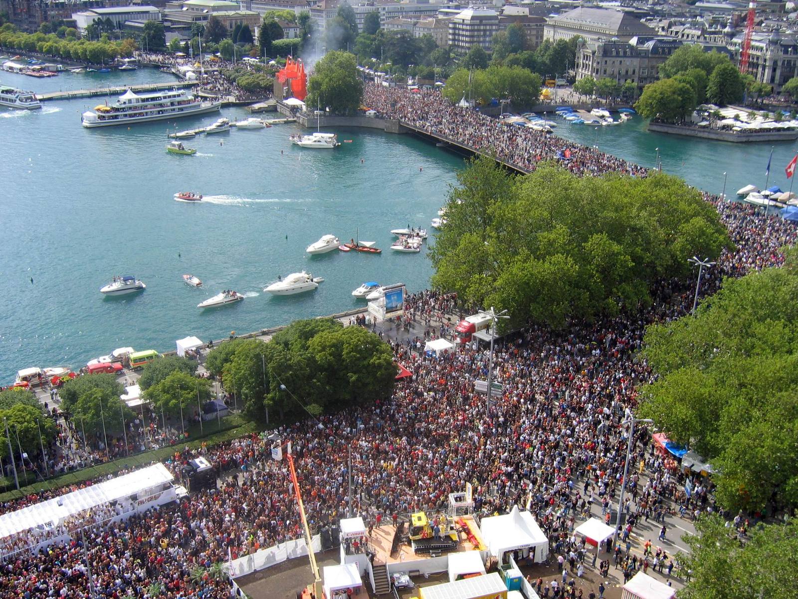 an overhead view of a crowded outdoor event in the city