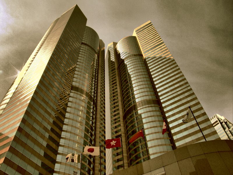 tall buildings in front of a cloudy sky