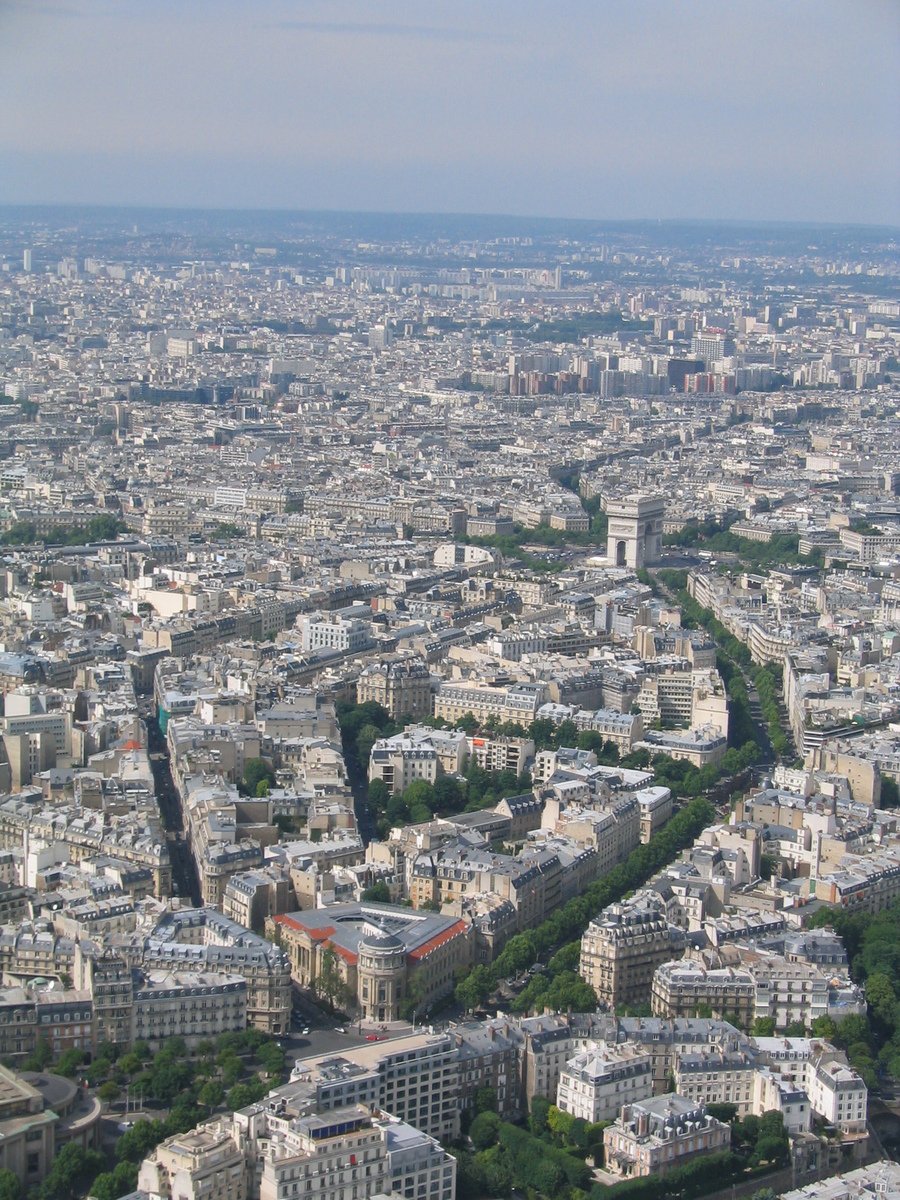 view from an airplane window of city buildings