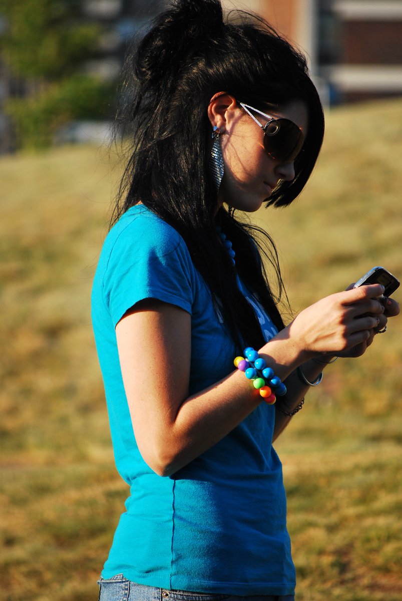 a woman with a very cute phone in her hands