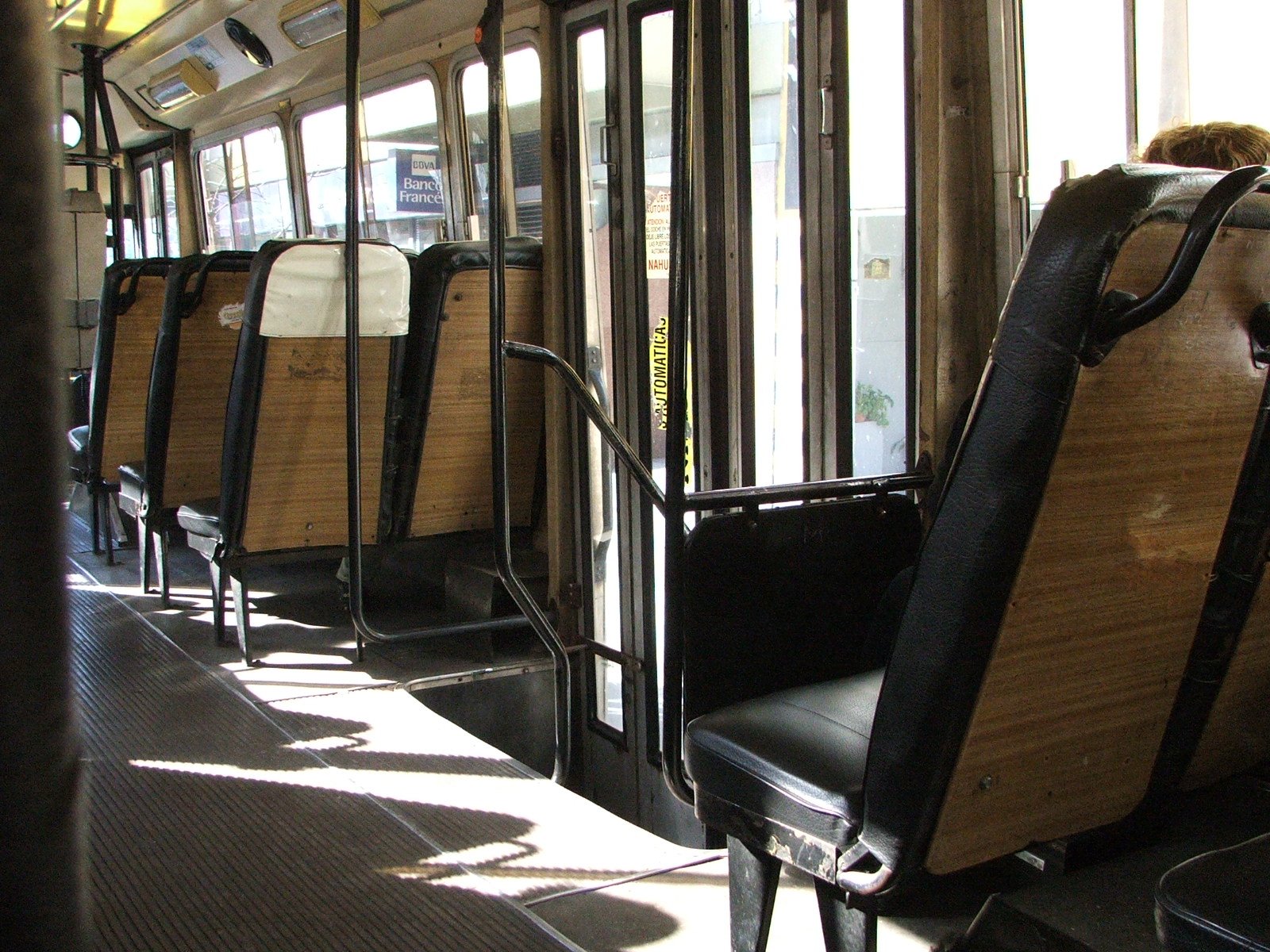 empty seats are set up on a crowded bus