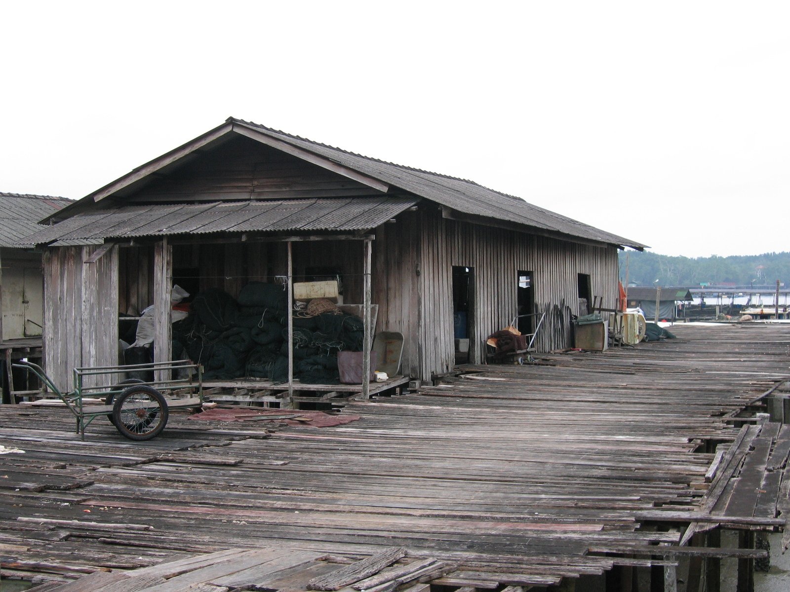 a boardwalk house with a bike parked outside of it