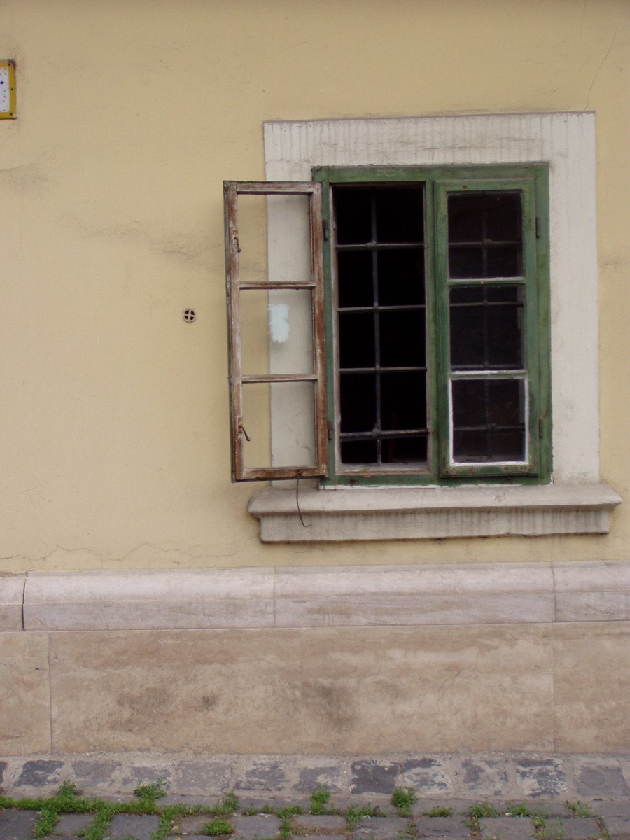 window in wall with cement border and small windows