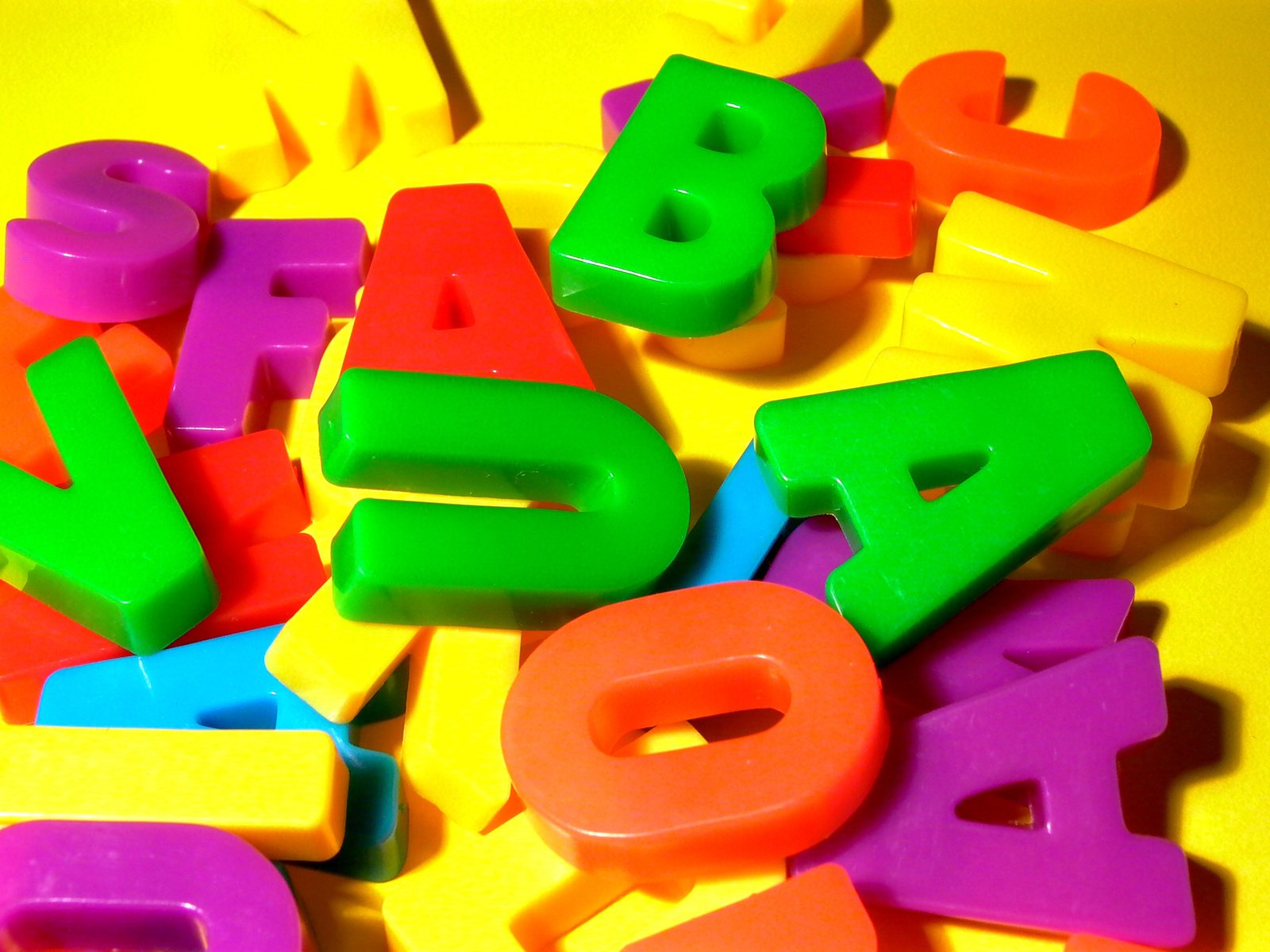 many colorful plastic toys with numbers on top of them