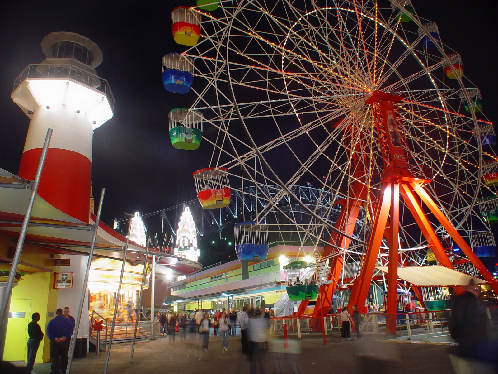 a ferris wheel is at night in an amut park