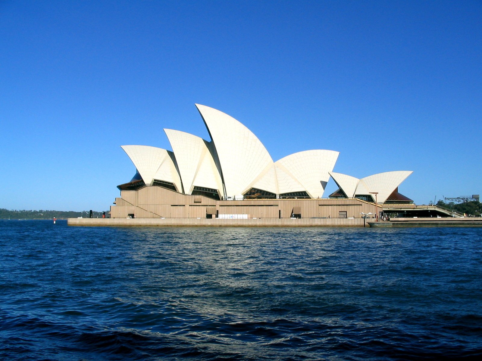 the sydney opera house is viewed from across the water