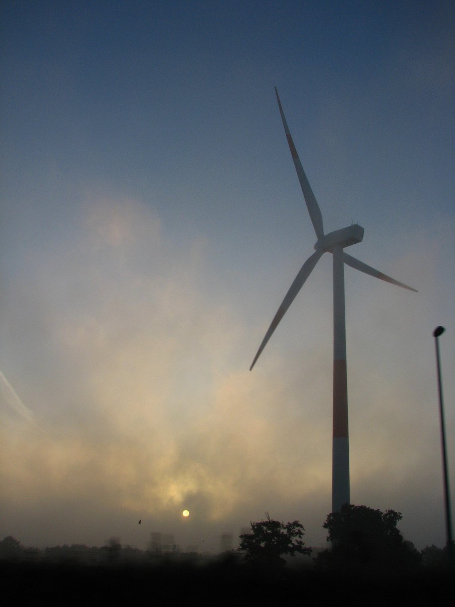 the po is taken outside, of a wind farm