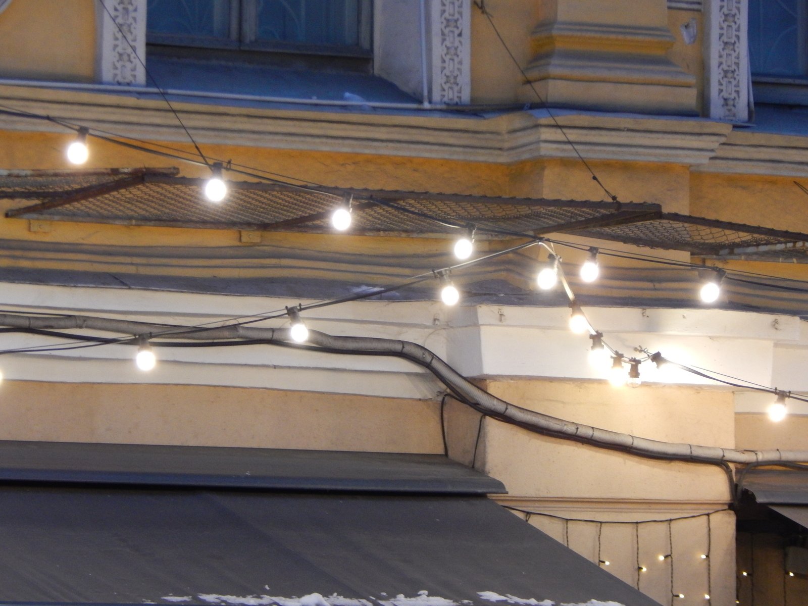 a building with many lights hanging from the roof