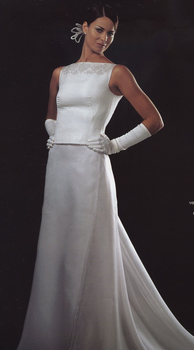 an attractively dressed woman in a white gown