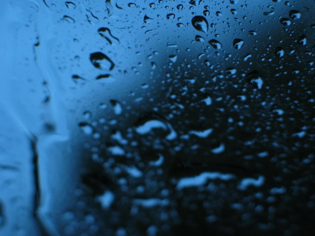 water droplets on a window at night