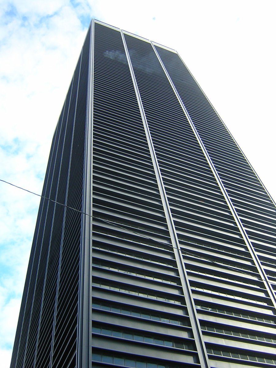 the top of a tall black skyscr building