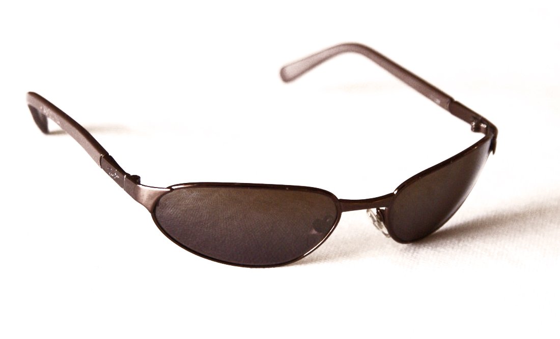 a black sunglasses with metal temples and two curved sides