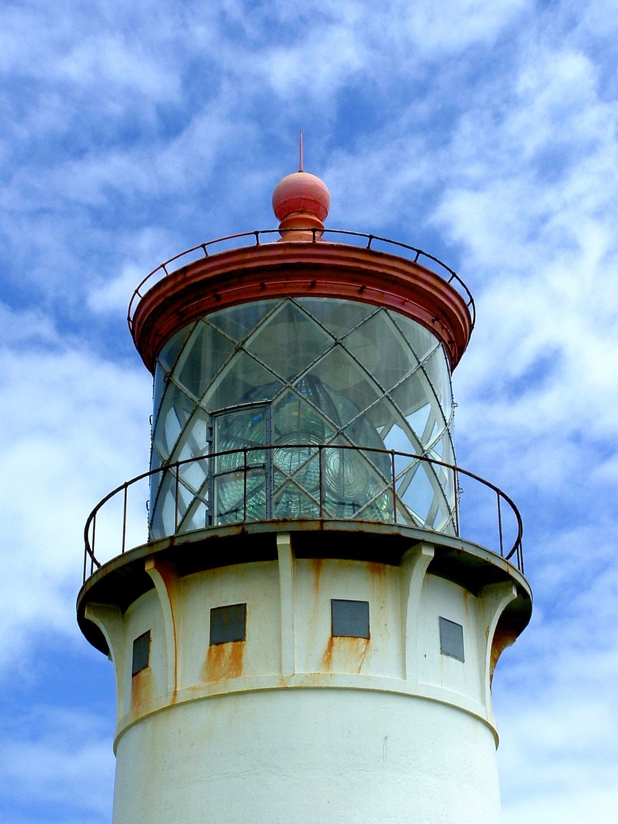 a large light house with a red top