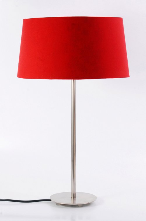 a lamp with a red shade on top and a wire plugged