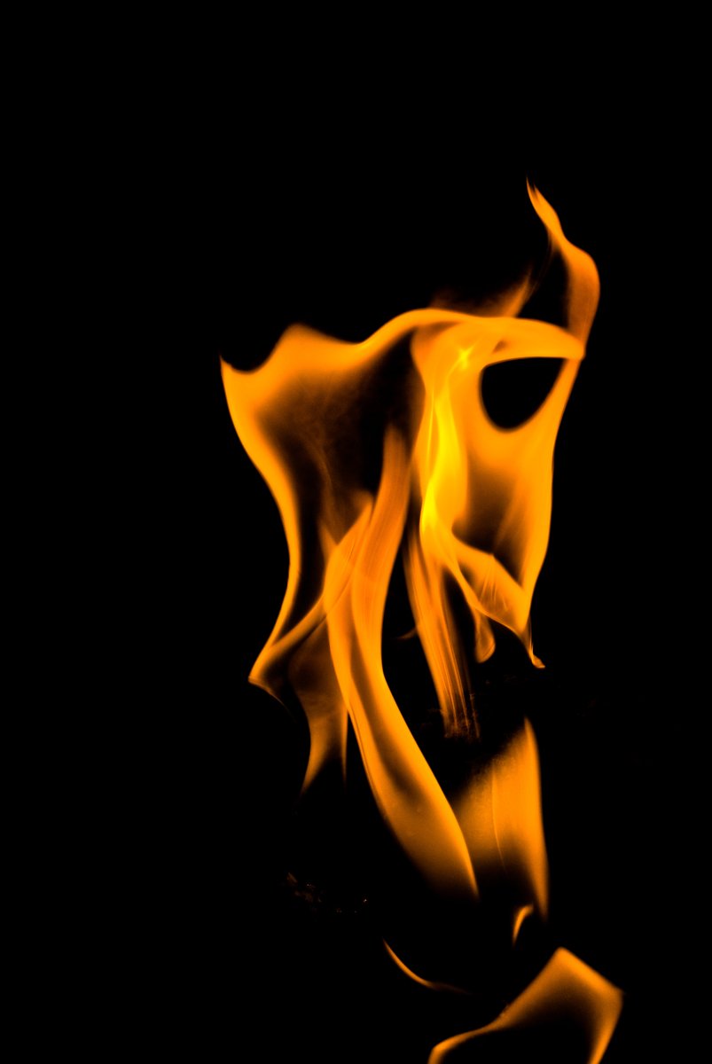 yellow flames with black background and blurry