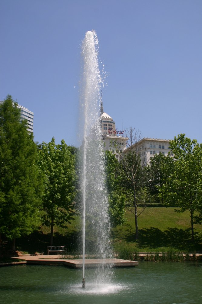 the view of a water fountain from the side