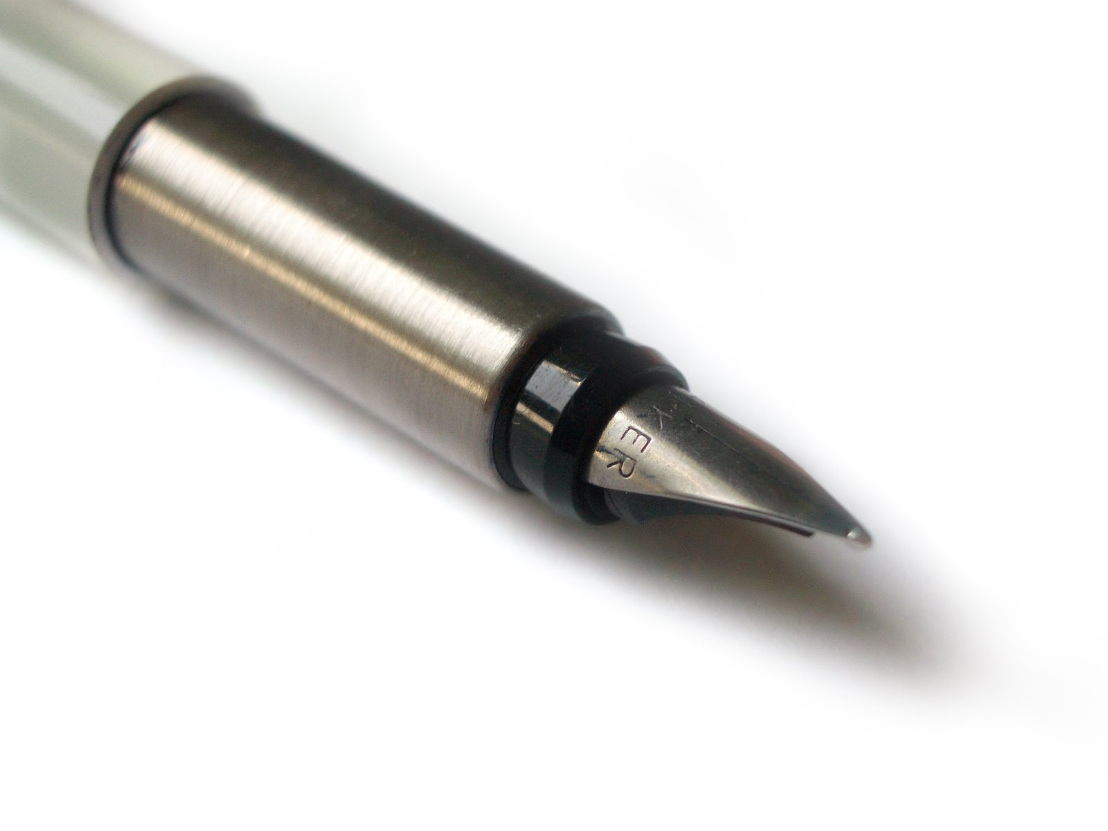 a metal fountain pen on a white background