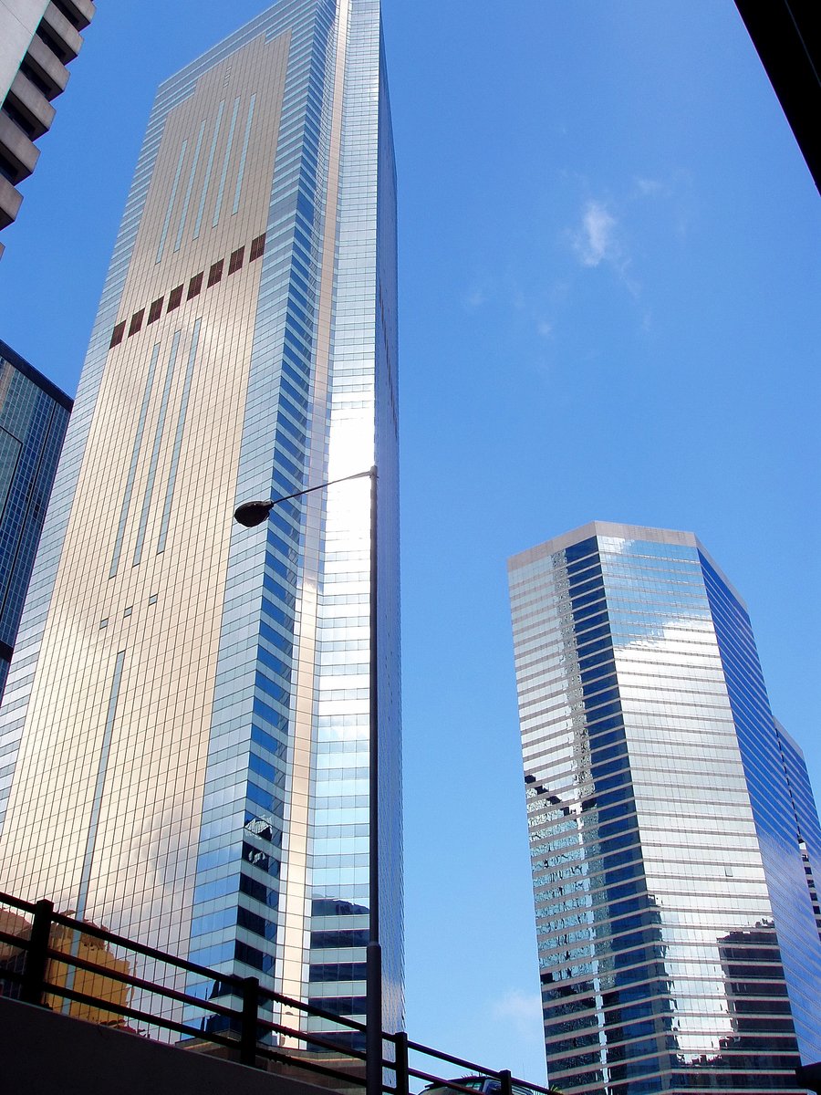 a row of tall glass office buildings