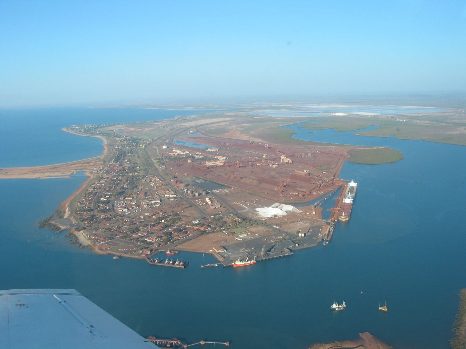 the view from an airplane of the land and water below