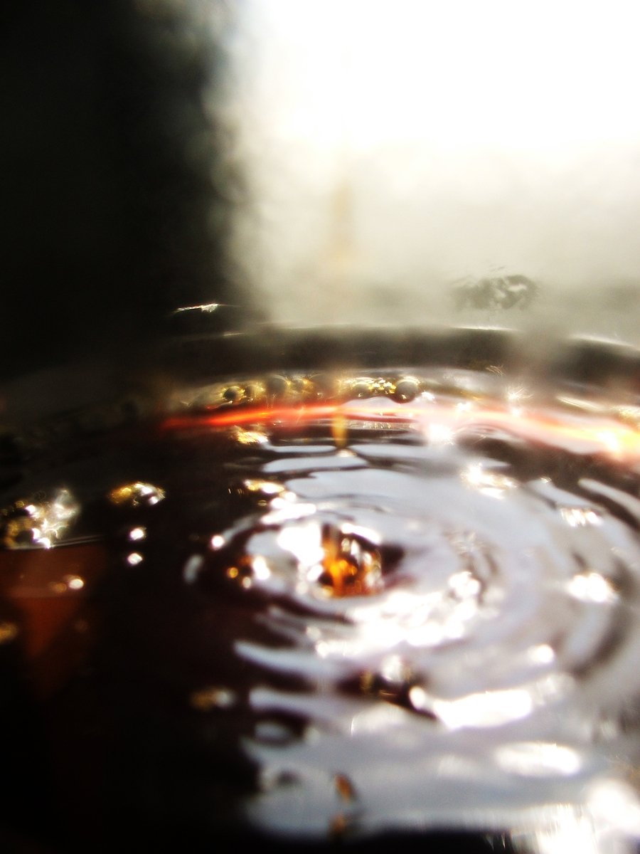  oil in a pan with light coming from the top