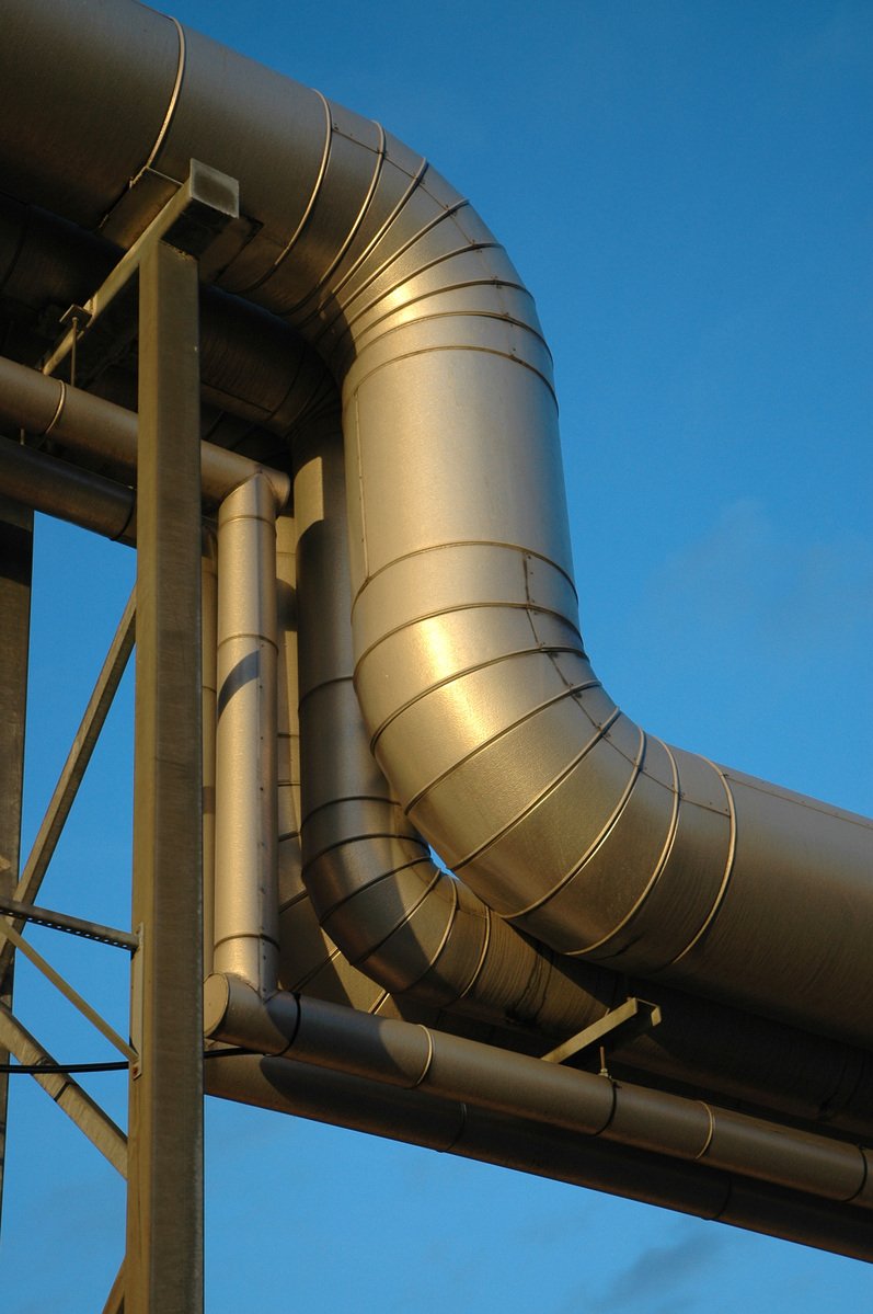 a view of a very large pipe near a building