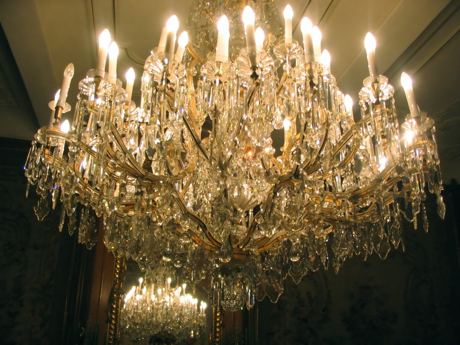 a chandelier hanging from a ceiling in a room