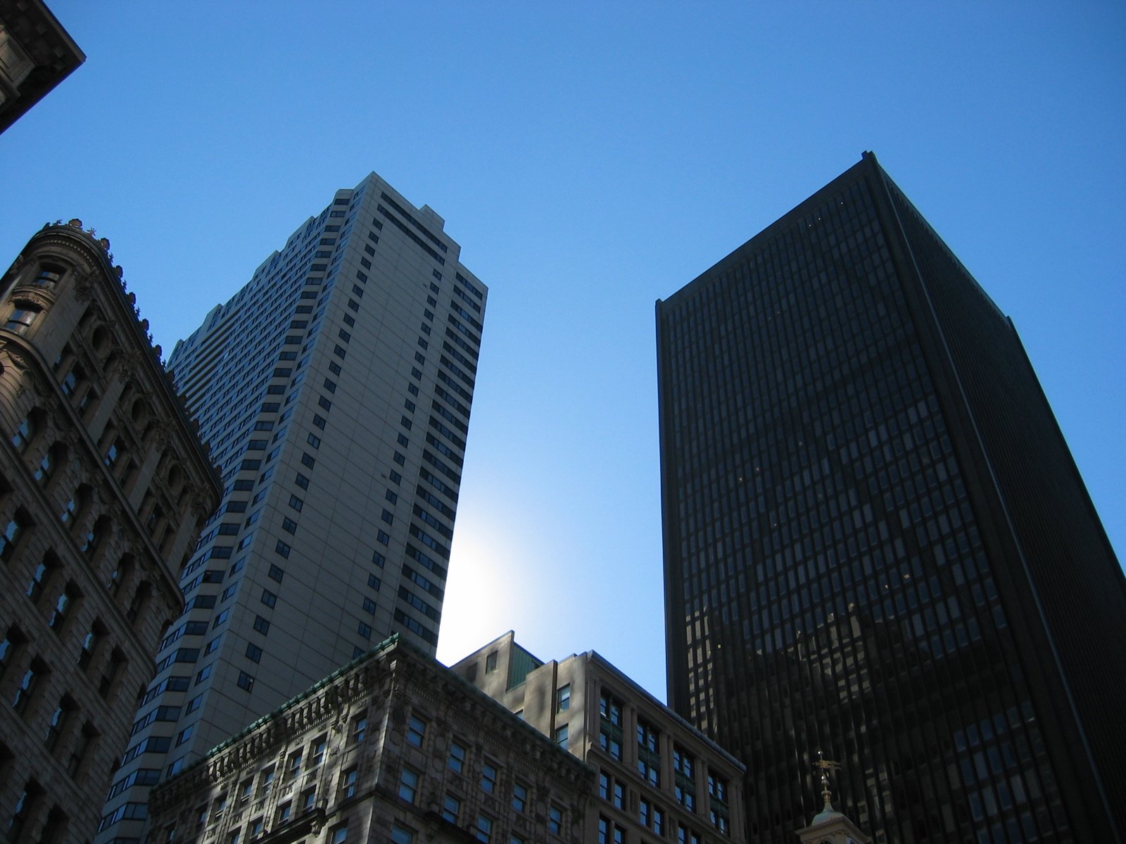 two buildings stand next to each other, in the city