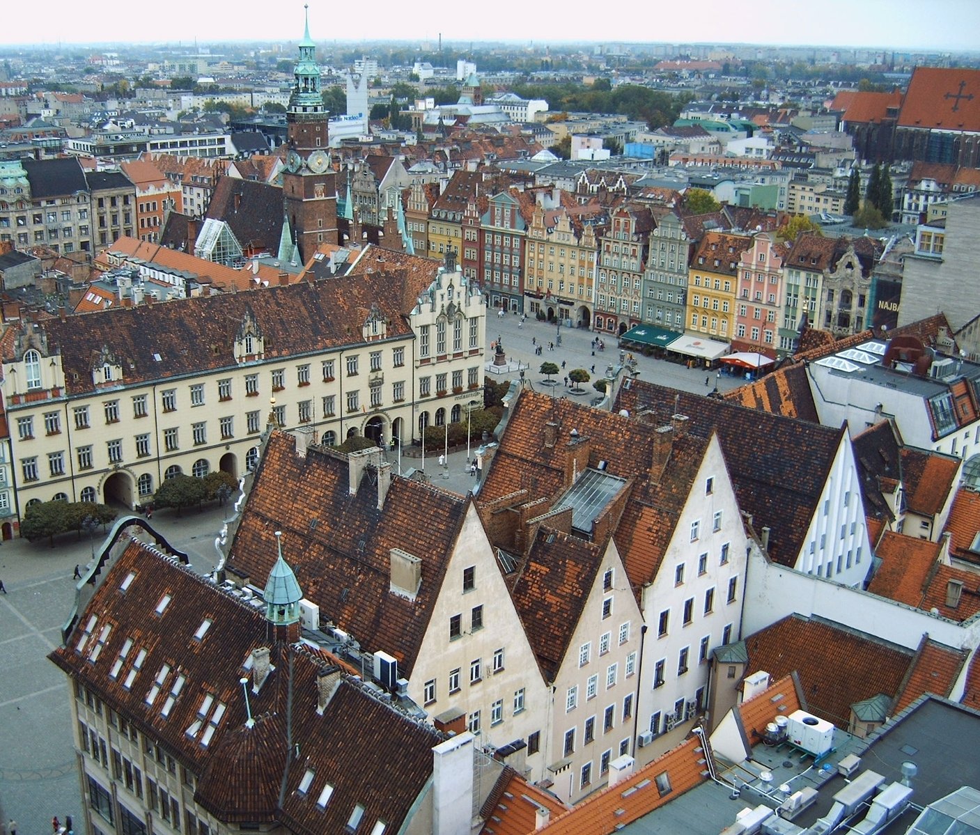 a view over the rooftops and old buildings in an older town