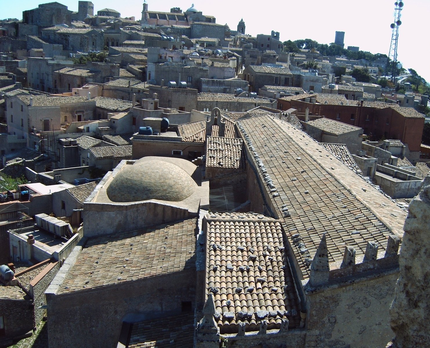 an old rooftop city is seen in this image